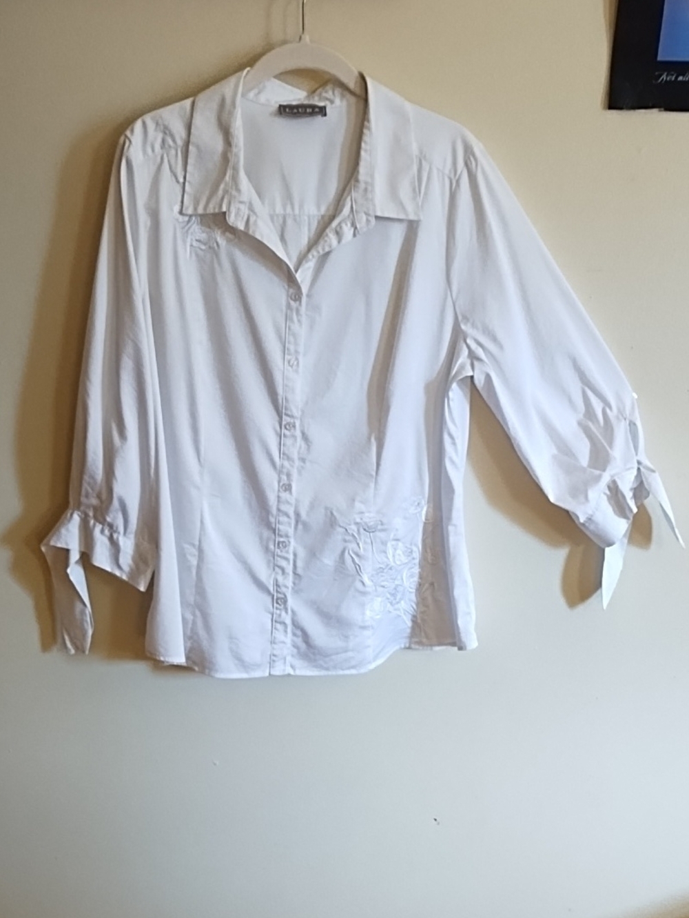 LAURA WHITE BLOUSE, BEAUTIFUL WHITE ON WHITE EMBROIDERY, TIES AT THE WRISTS.